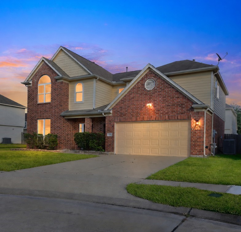 4938 Yearling Ridge Court Katy, TX 77449 - Photo 3 of 29 a front view of a house with a yard and garage