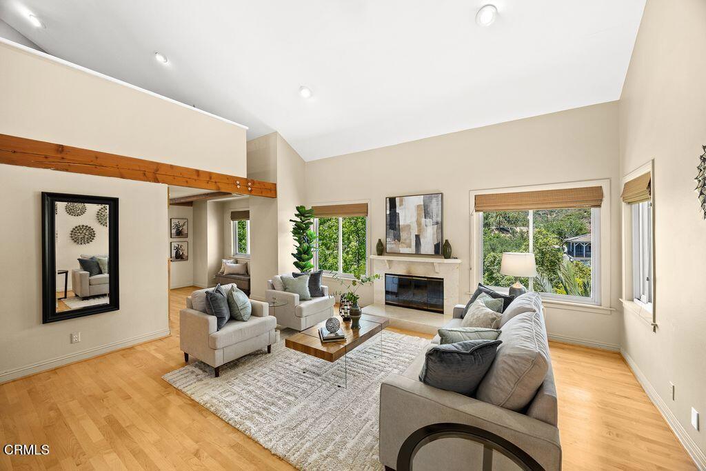 405 Woodcliffe Road Pasadena, CA 91105 - Photo 5 of 24 a living room with furniture large window and a fireplace