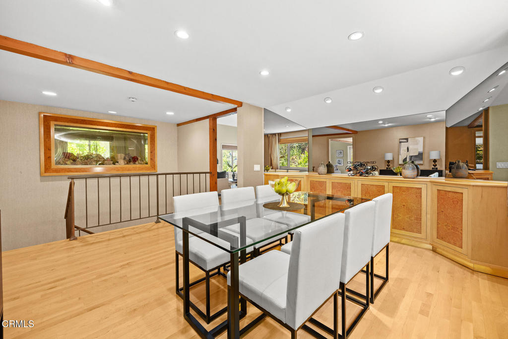 405 Woodcliffe Road Pasadena, CA 91105 - Photo 7 of 24 a dining hall with stainless steel appliances a dining table and chairs