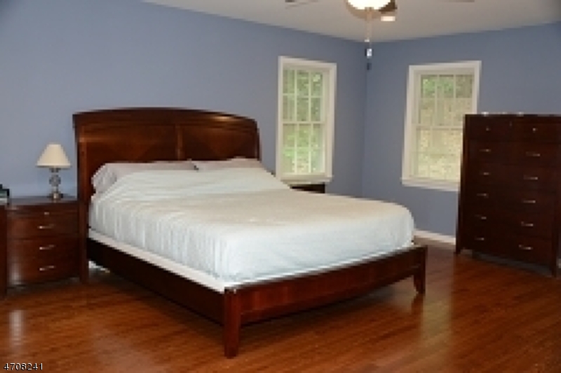5 Deer Run Drive Randolph, NJ 07869 - Photo 13 of 25 a bedroom with a bed and window