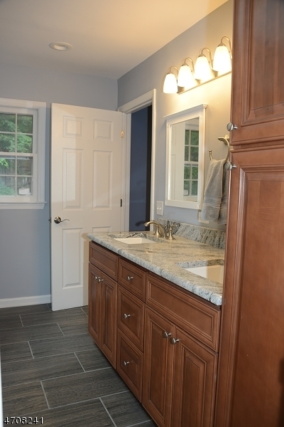 5 Deer Run Drive Randolph, NJ 07869 - Photo 14 of 25 a bathroom with a granite countertop sink and a mirror