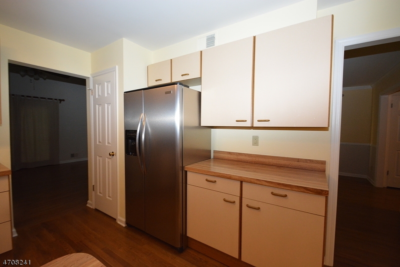5 Deer Run Drive Randolph, NJ 07869 - Photo 7 of 25 a kitchen with a refrigerator and cabinets
