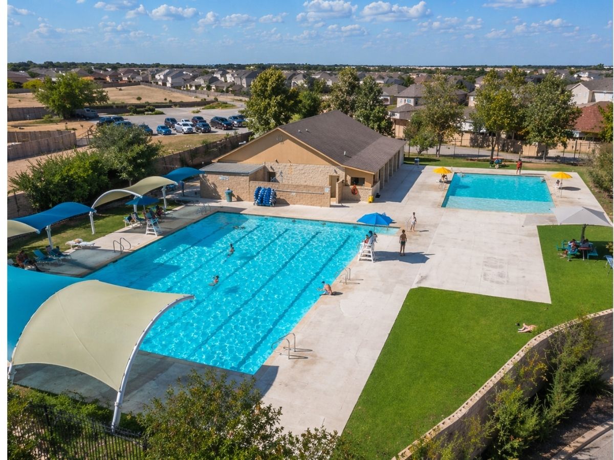 3000 Cressler Lane Jarrell, TX 76537 - Photo 25 of 26 an aerial view of residential houses with outdoor space and swimming pool