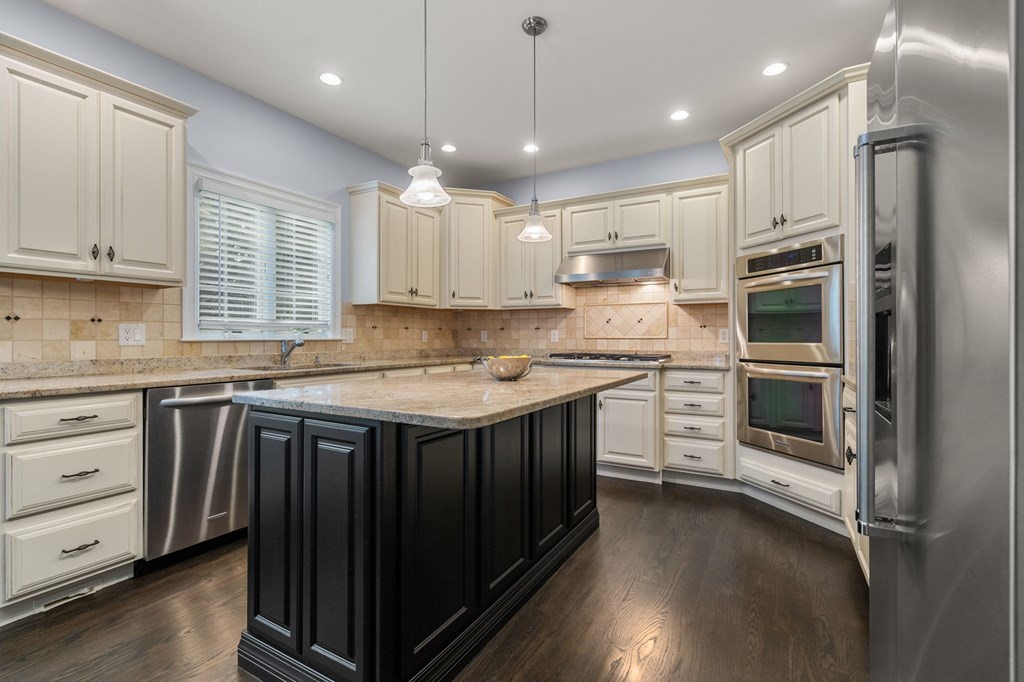 29 Smith Street Needham, MA 02492 - Photo 13 of 31 a kitchen with a refrigerator stove and cabinets