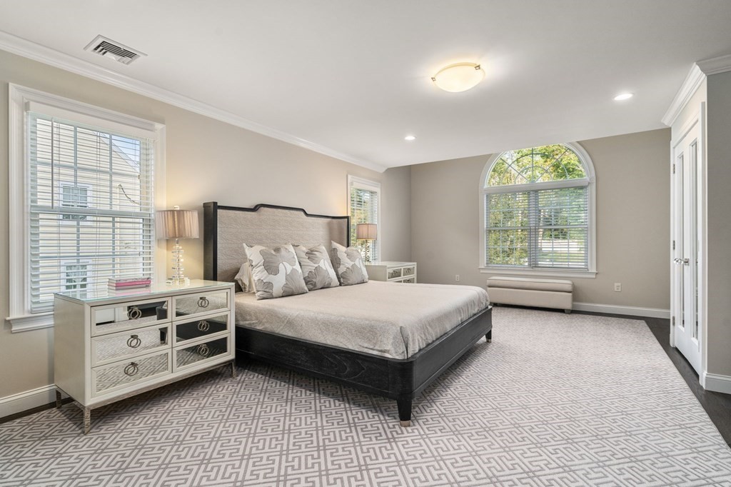 29 Smith Street Needham, MA 02492 - Photo 16 of 31 a spacious bedroom with a bed and a window