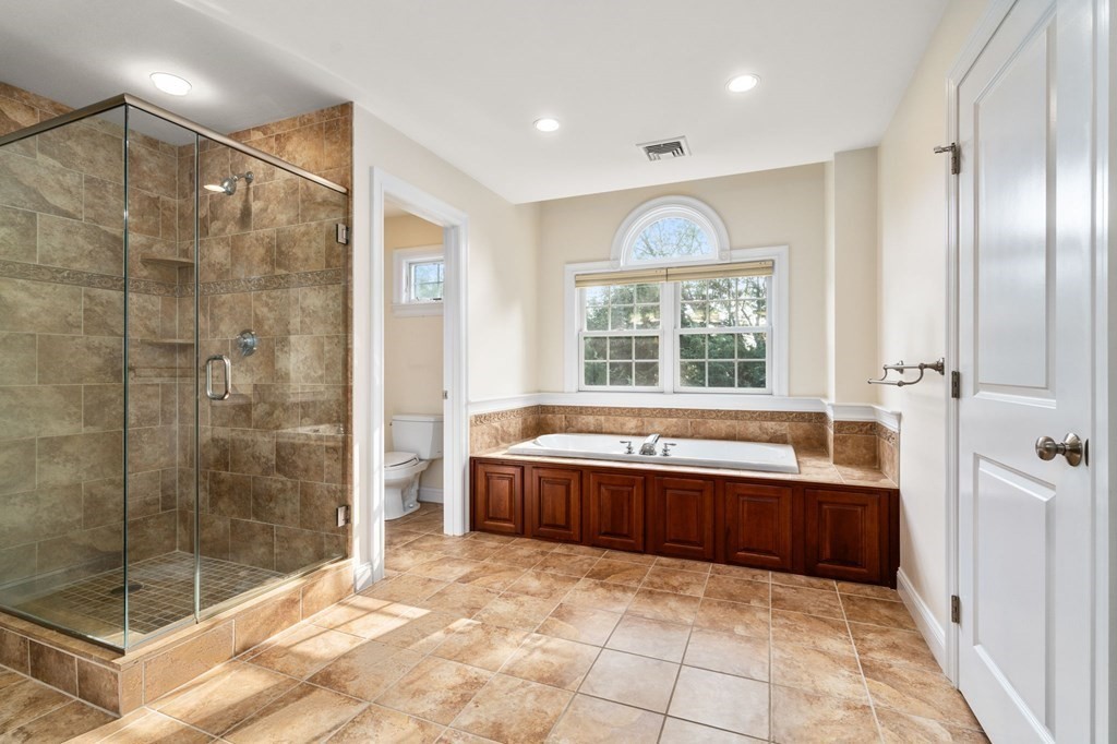 29 Smith Street Needham, MA 02492 - Photo 18 of 31 a spacious bathroom with a large tub shower and windows
