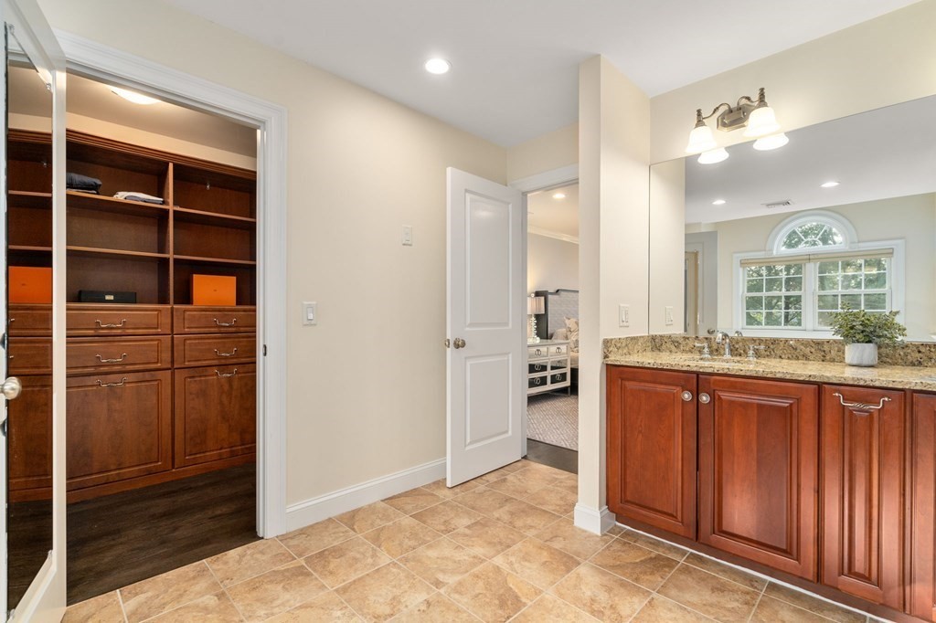 29 Smith Street Needham, MA 02492 - Photo 19 of 31 a bathroom with a granite countertop sink mirror and shower