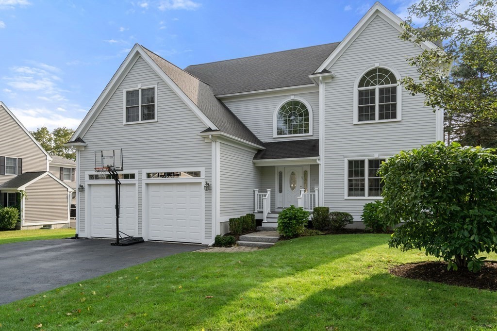 29 Smith Street Needham, MA 02492 - Photo 2 of 31 a front view of a house with a garden and plants