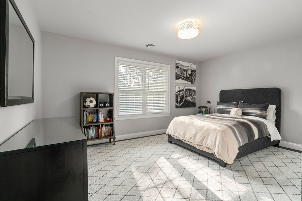 29 Smith Street Needham, MA 02492 - Photo 21 of 31 a bedroom with a bed and a window