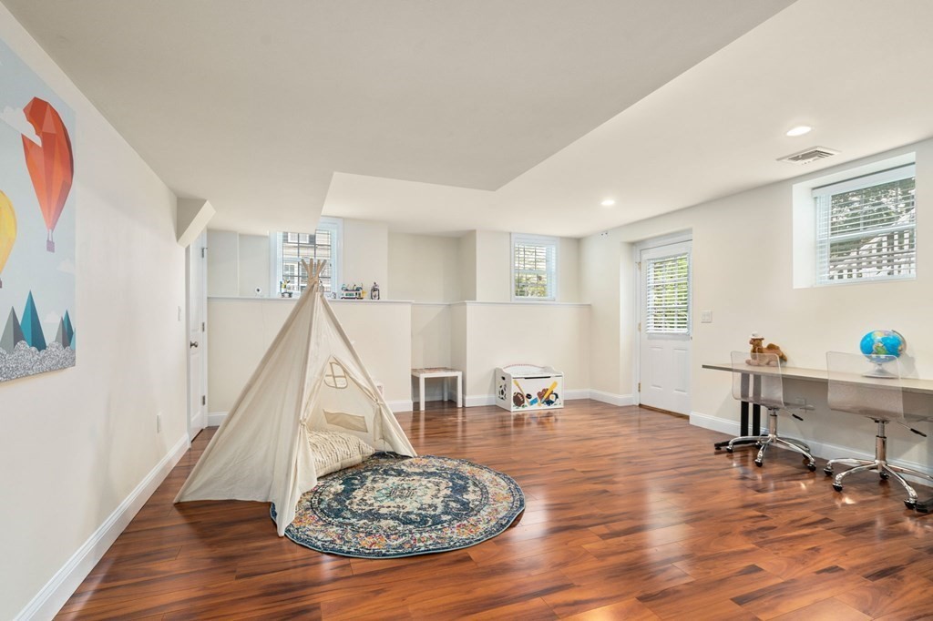 29 Smith Street Needham, MA 02492 - Photo 26 of 31 a view of entryway dining room and hall with wooden floor