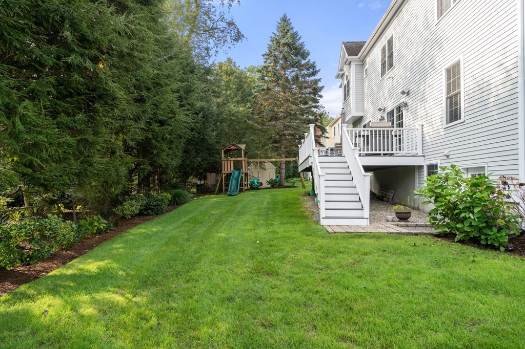 29 Smith Street Needham, MA 02492 - Photo 29 of 31 a view of a house with a yard and sitting area