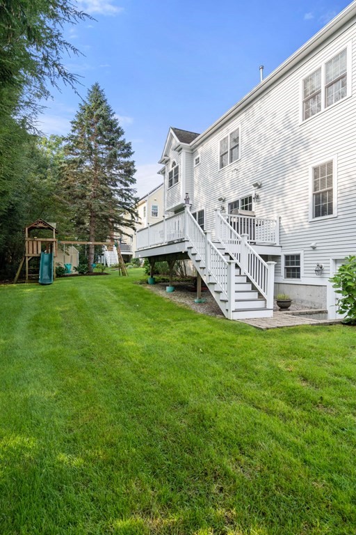 29 Smith Street Needham, MA 02492 - Photo 30 of 31 a view of a house with a backyard