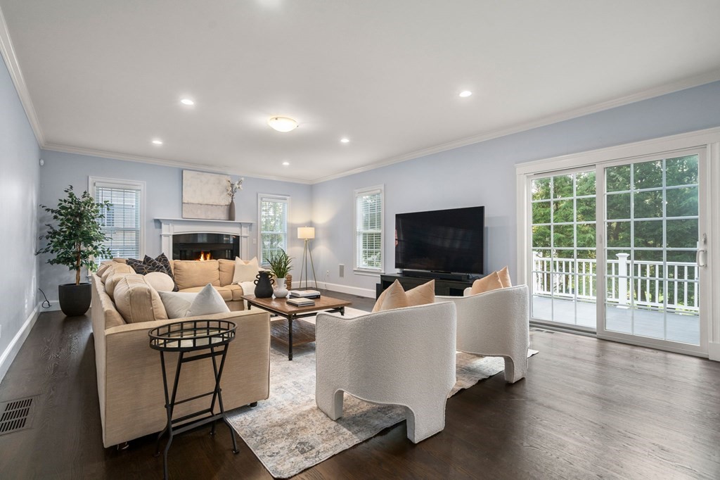 29 Smith Street Needham, MA 02492 - Photo 8 of 31 a living room with furniture and a flat screen tv