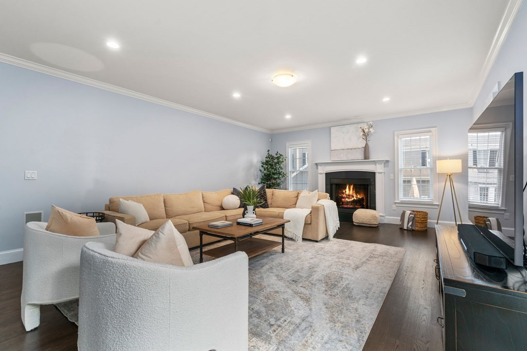 29 Smith Street Needham, MA 02492 - Photo 9 of 31 a living room with furniture a fireplace and a fireplace