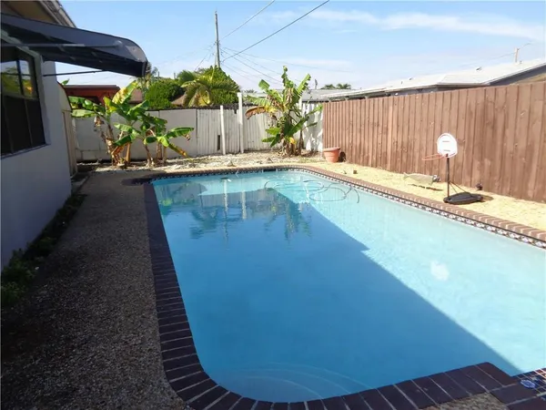 a view of a swimming pool with a patio