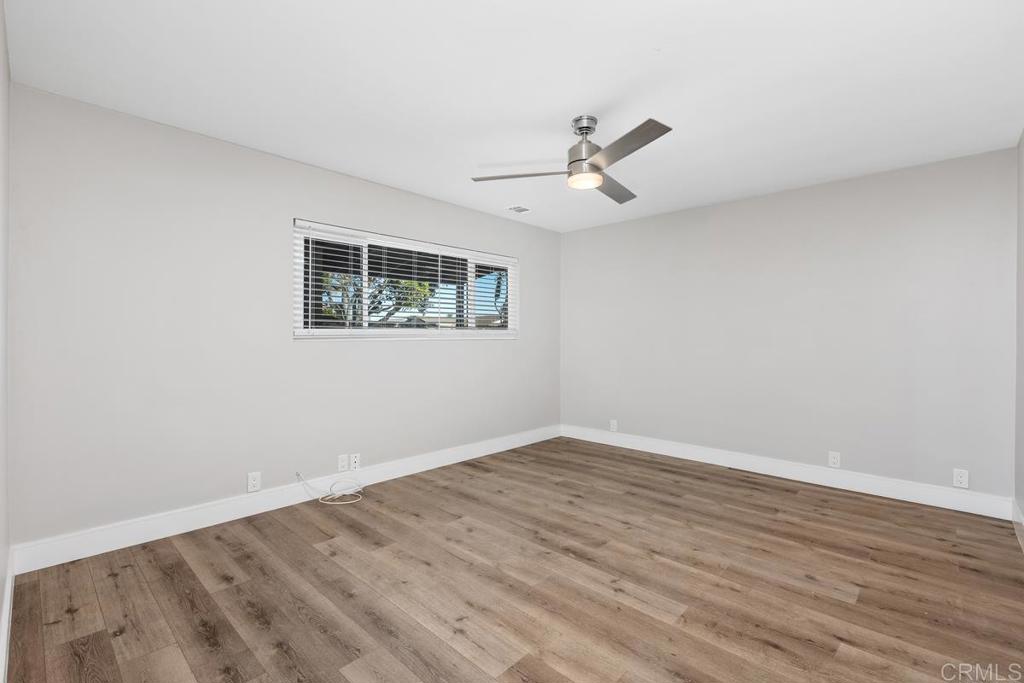 1134 Montura Road, Unit MAIN HOUSE San Marcos, CA 92078 - Photo 16 of 31 wooden floor in an empty room with a window