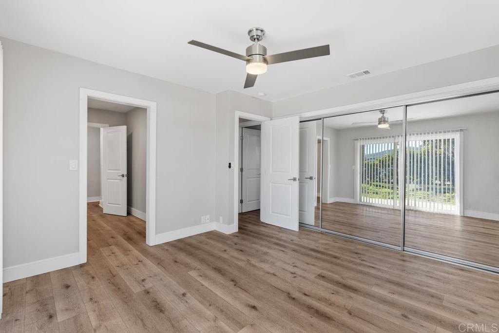 1134 Montura Road, Unit MAIN HOUSE San Marcos, CA 92078 - Photo 22 of 31 a view of a room with wooden floor and white walls
