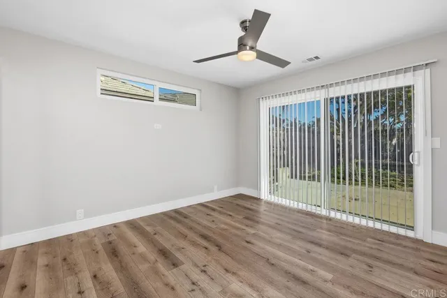 a view of a room with wooden floor