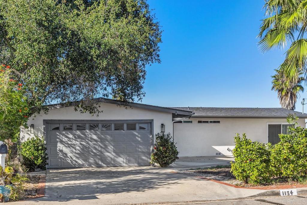 1134 Montura Road, Unit MAIN HOUSE San Marcos, CA 92078 - Photo 29 of 31 front view of a house with a street
