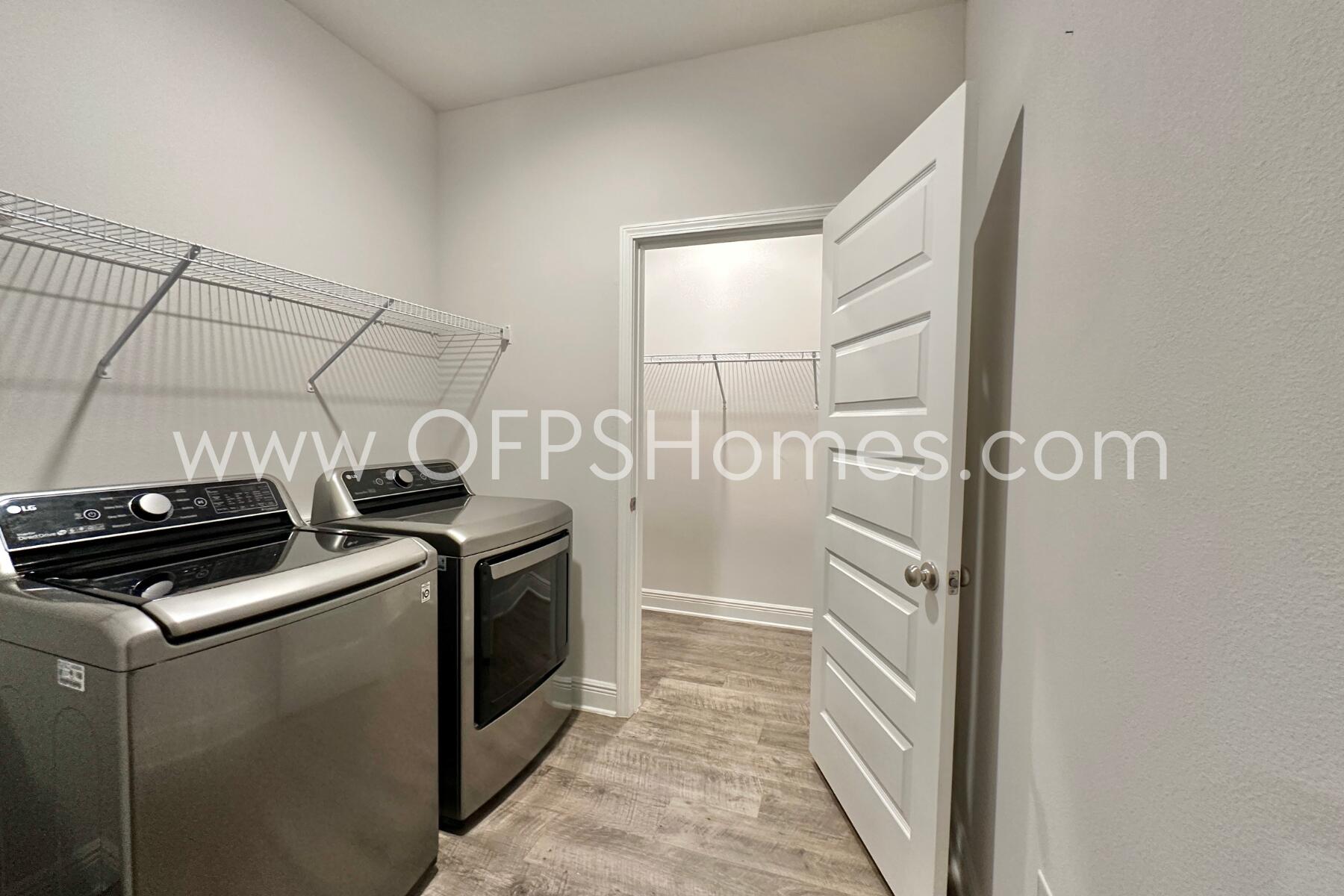8090 Silver Maple Drive Milton, FL 32583 - Photo 26 of 42 a kitchen with a stove and a refrigerator