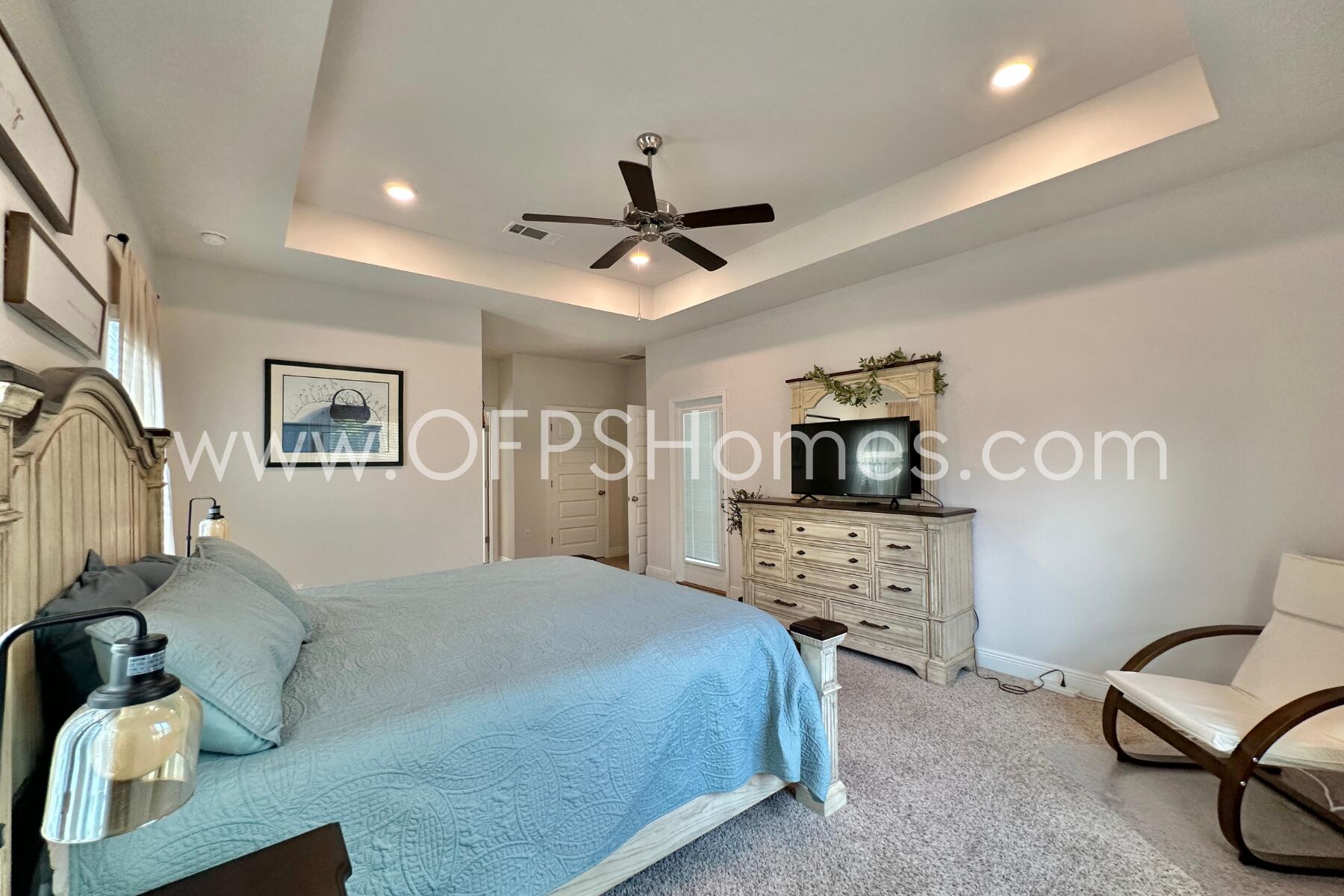 8090 Silver Maple Drive Milton, FL 32583 - Photo 34 of 42 a bedroom with a bed couch and a window