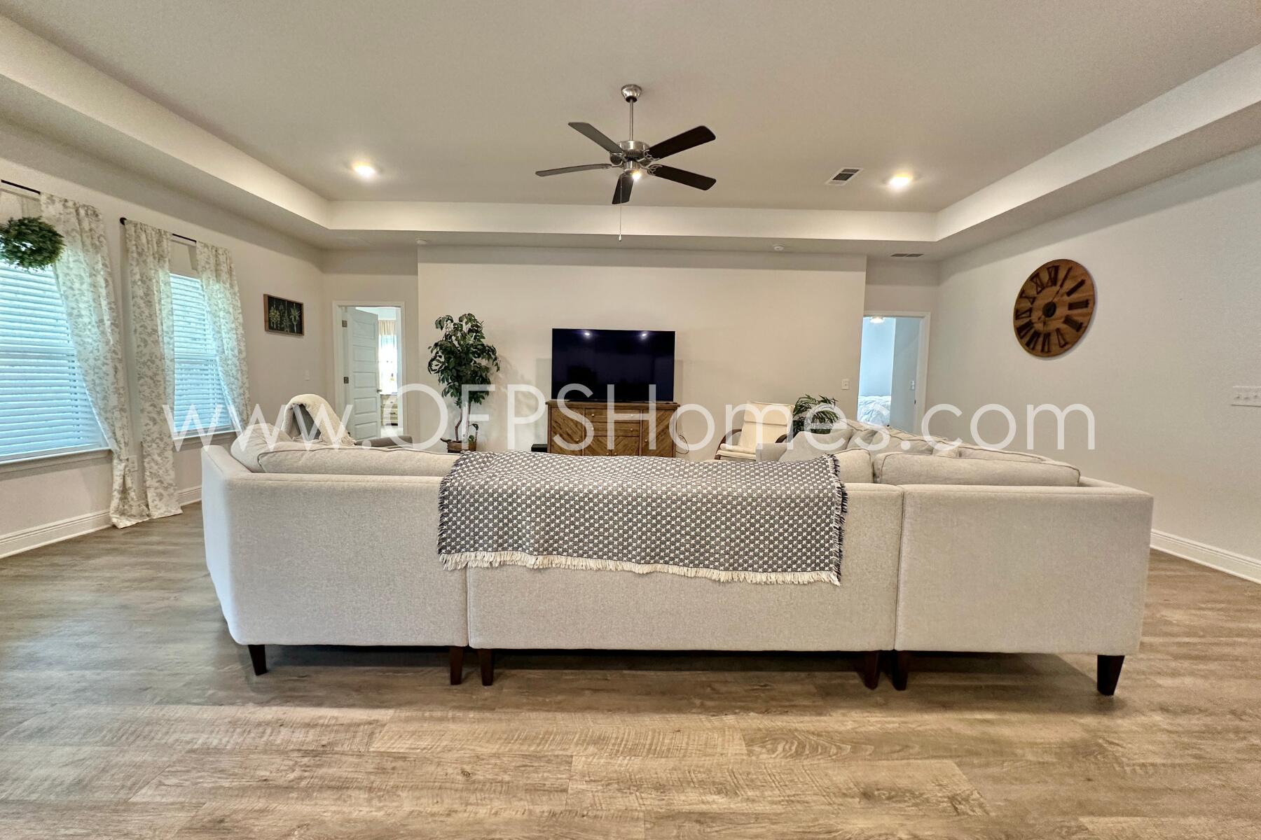 8090 Silver Maple Drive Milton, FL 32583 - Photo 10 of 42 a living room with furniture and a large window