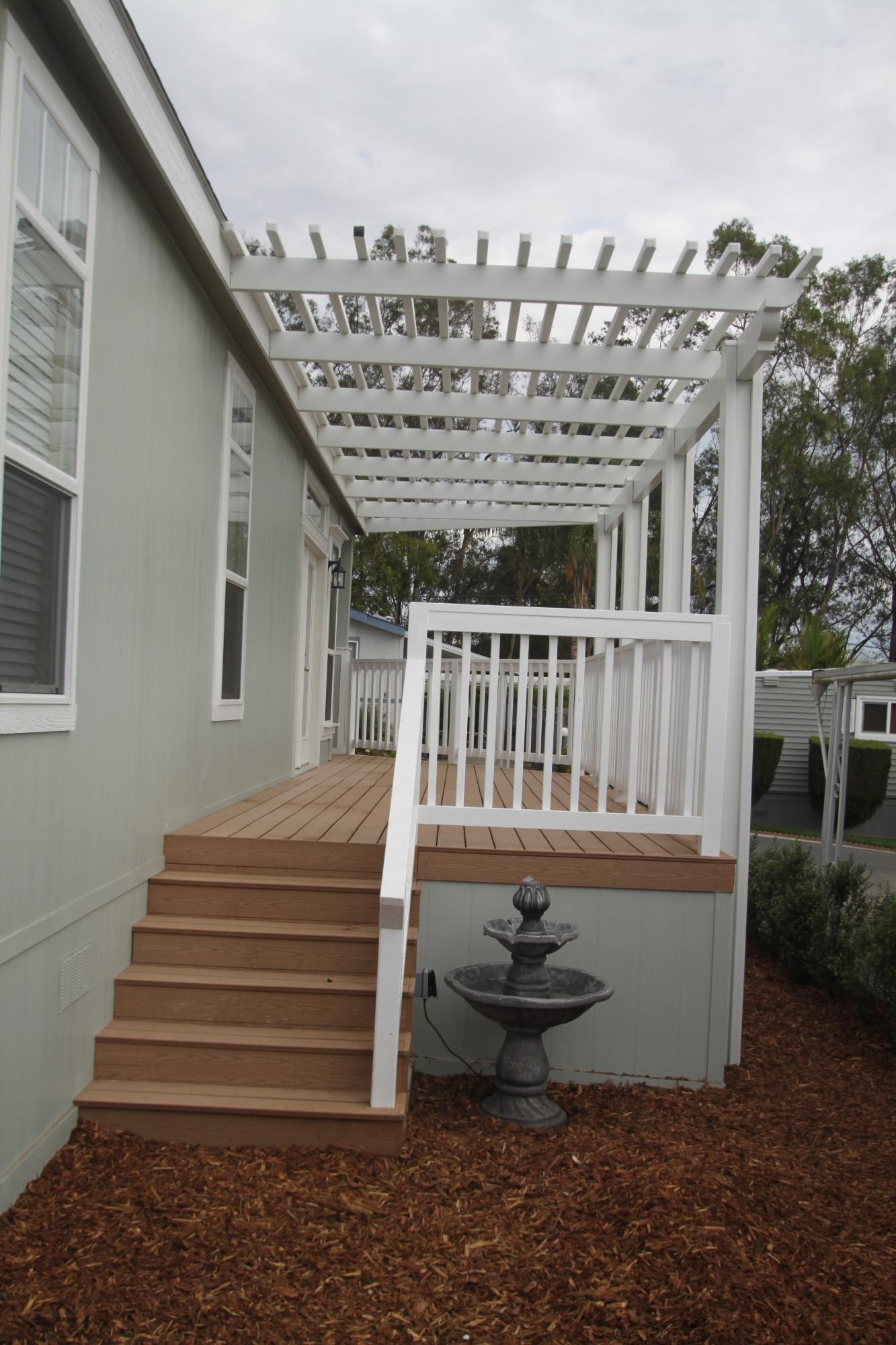 30 Winchester Canyon Road, Unit 126 Goleta, CA 93117 - Photo 3 of 3 a view of a house with a yard and sitting area