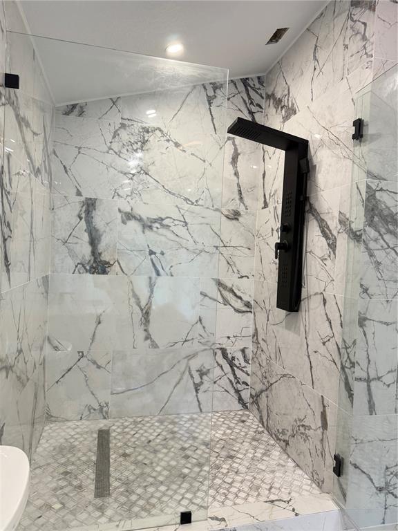 14273 Nugent Circle Spring Hill, FL 34609 - Photo 15 of 27 a bathroom with a shower