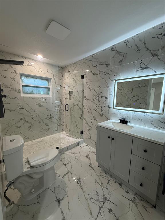14273 Nugent Circle Spring Hill, FL 34609 - Photo 27 of 27 a bathroom with a double vanity sink toilet and shower
