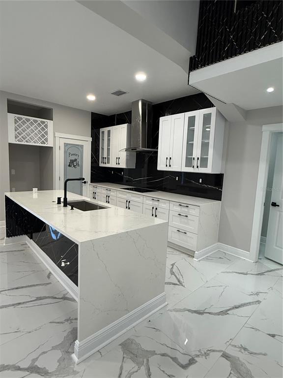 14273 Nugent Circle Spring Hill, FL 34609 - Photo 4 of 27 a kitchen with granite countertop a sink a stove and cabinets