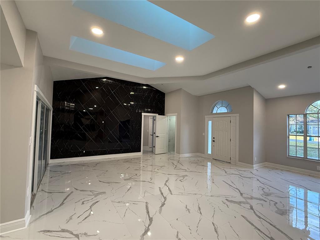 14273 Nugent Circle Spring Hill, FL 34609 - Photo 8 of 27 a view of entryway with a hallway