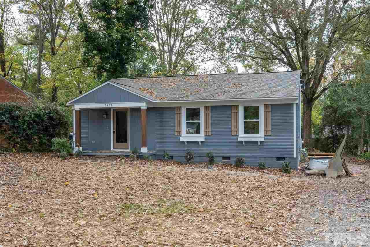 2408 Milburnie Road Raleigh, NC 27610 - Photo 1 of 25 a front view of a house with garden