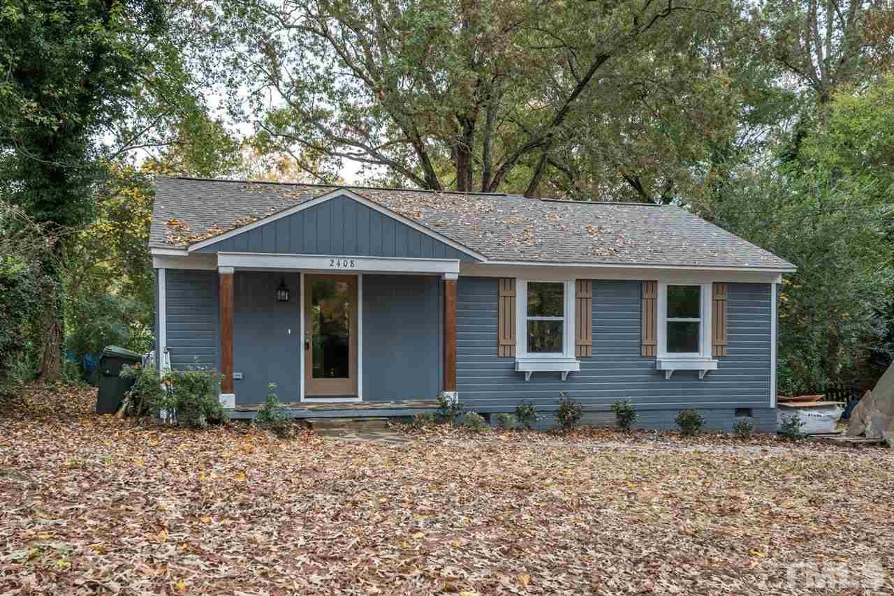 2408 Milburnie Road Raleigh, NC 27610 - Photo 3 of 25 a front view of a house with garden