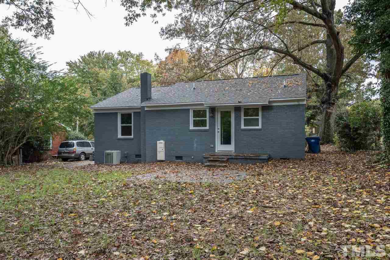 2408 Milburnie Road Raleigh, NC 27610 - Photo 24 of 25 a house that has a tree in front of it