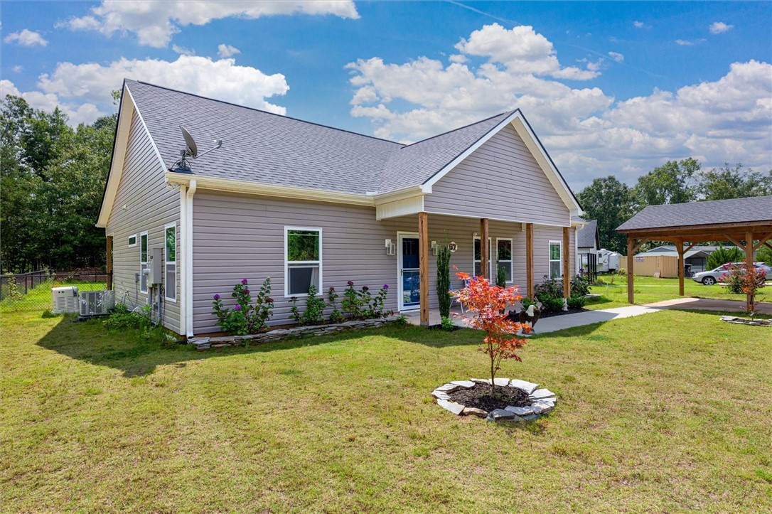 67 Sawblade Ridge Marietta, SC 29661 - Photo 2 of 37 A classic gabled roofline and covered front porch highlight this modern single-family exterior.