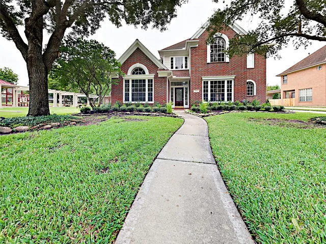 a front view of a house with yard