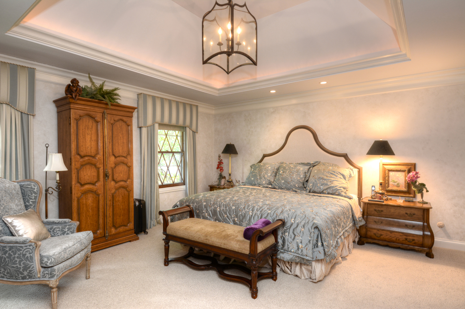 4-n034 Thornapple Road St. Charles, IL 60174 - Photo 22 of 44 a bedroom with a bed and a chandelier