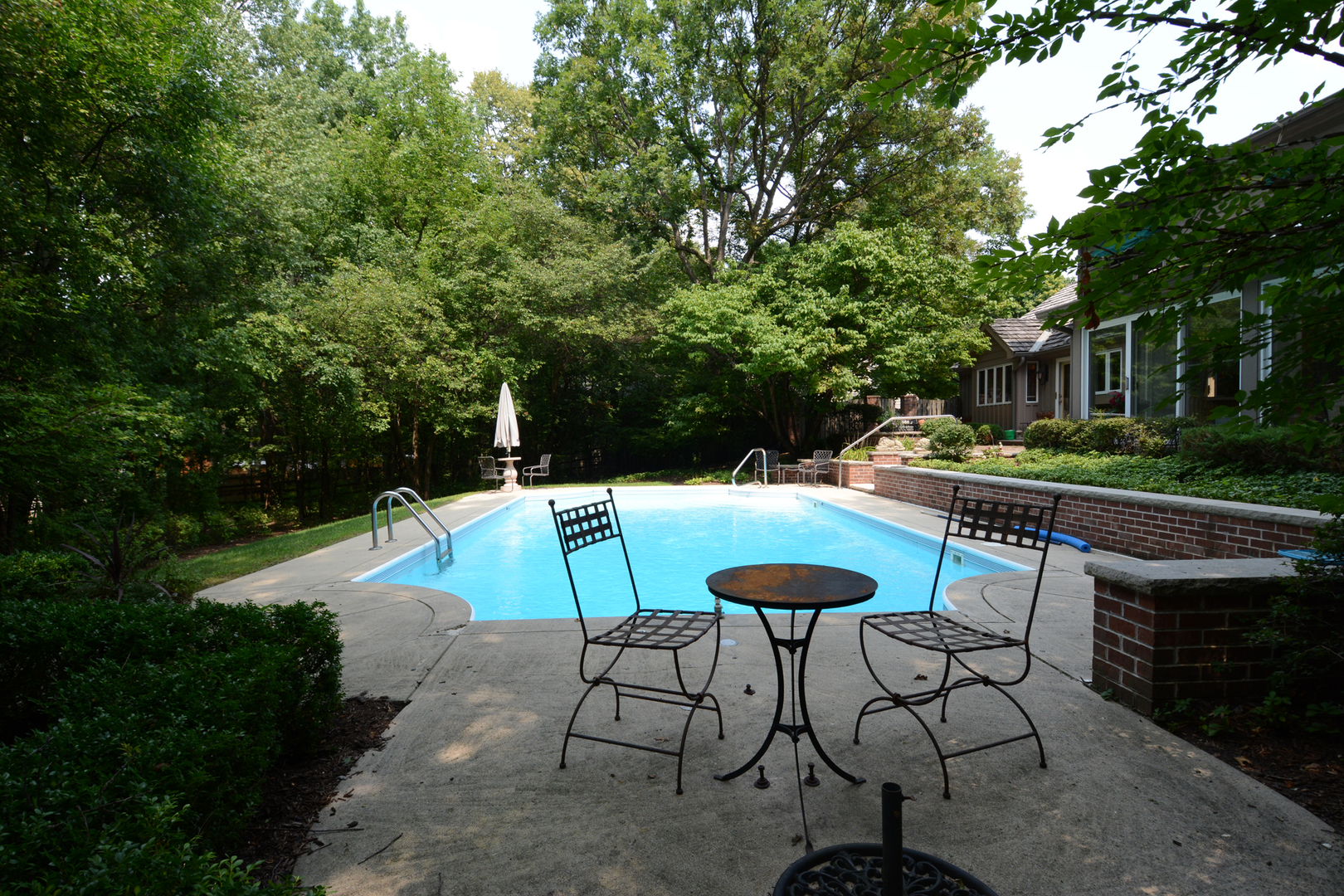 4-n034 Thornapple Road St. Charles, IL 60174 - Photo 36 of 44 a view of a swimming pool with chair and table