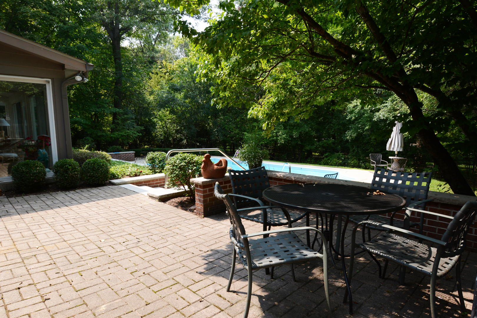 4-n034 Thornapple Road St. Charles, IL 60174 - Photo 37 of 44 a view of a patio with table and chairs a barbeque with wooden fence and plants