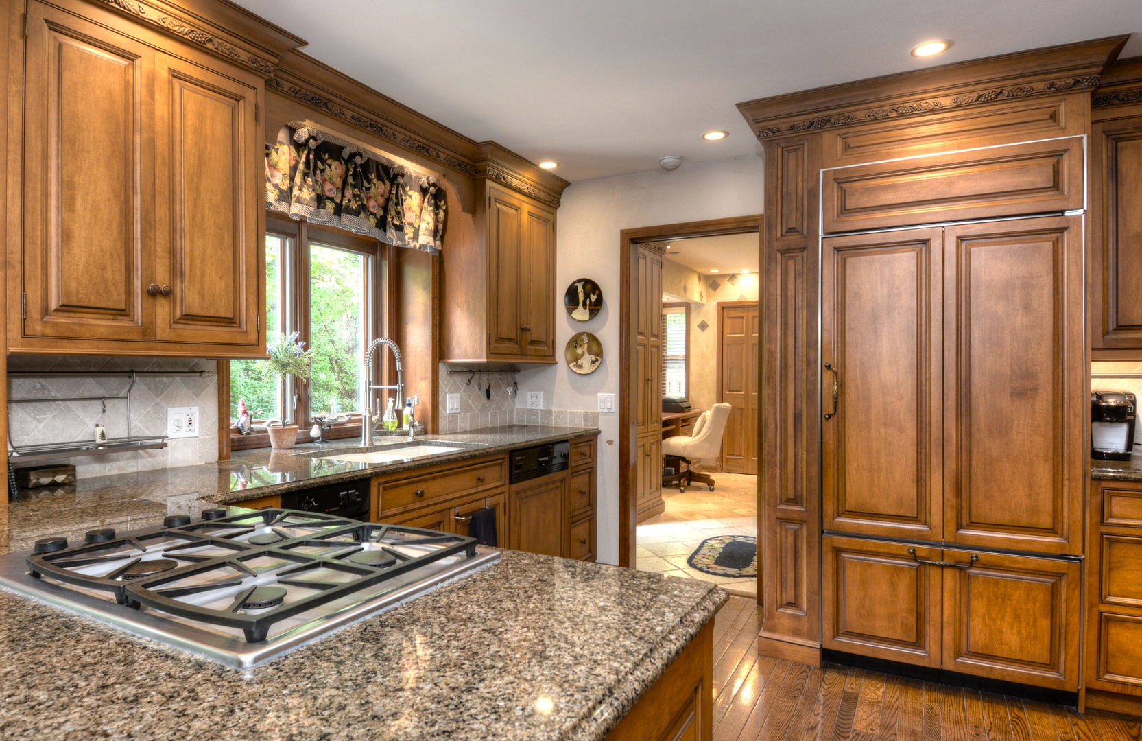 4-n034 Thornapple Road St. Charles, IL 60174 - Photo 5 of 44 a kitchen with stainless steel appliances granite countertop a refrigerator a sink and a stove with wooden floor