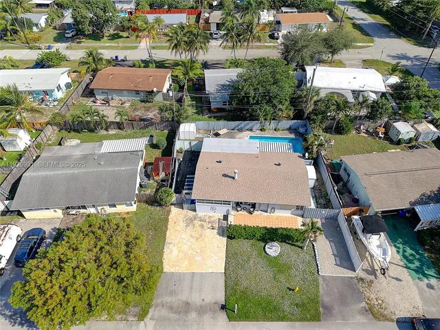 an aerial view of a house with a garden