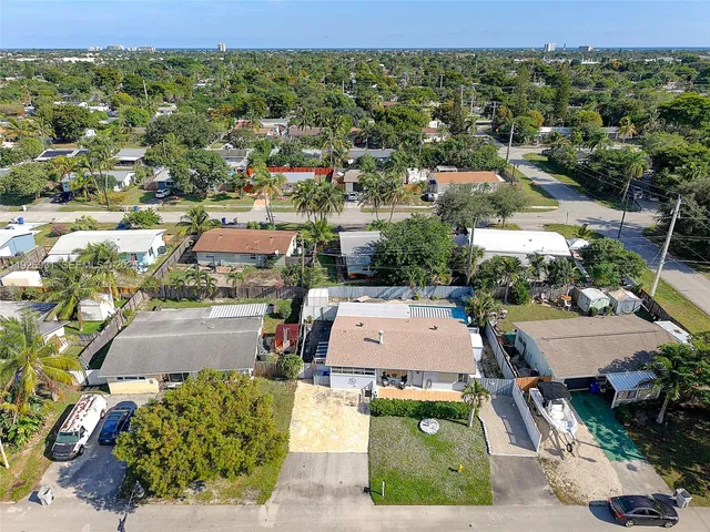 an aerial view of residential houses with outdoor space