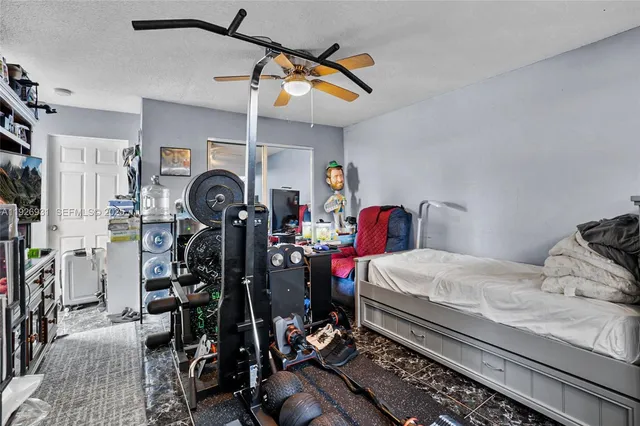 a bedroom with bed and a window