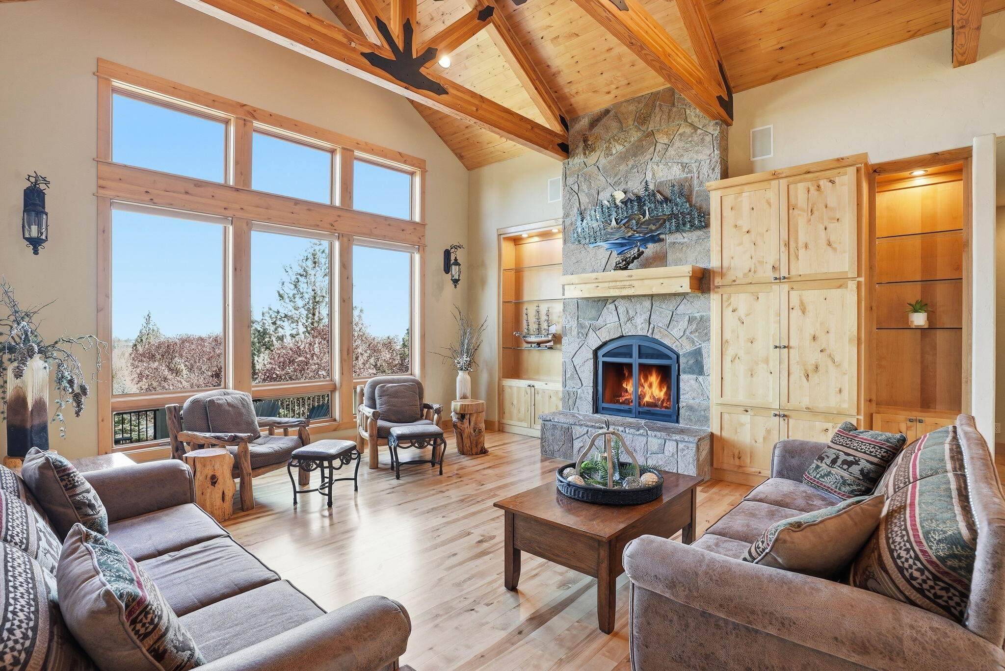 631 Sundance Ridge Court Redmond, OR 97756 - Photo 23 of 61 a living room with furniture fireplace and a large window