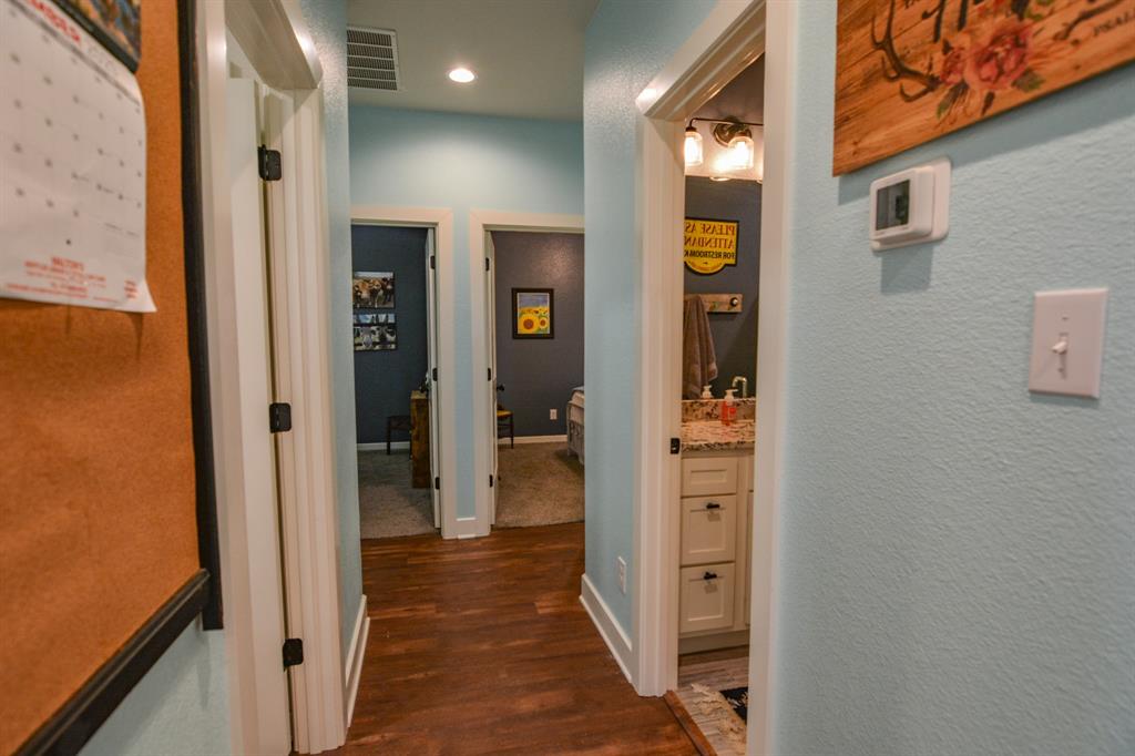 601 Mathew Street Grandview, TX 76050 - Photo 26 of 40 a view of a hallway with wooden floor and staircase