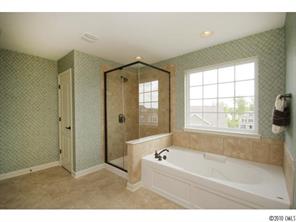 1305 Ridgehaven Road, Unit 165 Waxhaw, NC 28173 - Photo 13 of 16 a bathroom with a bathtub and a shower