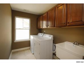 1305 Ridgehaven Road, Unit 165 Waxhaw, NC 28173 - Photo 9 of 16 a utility room with dryer and washer