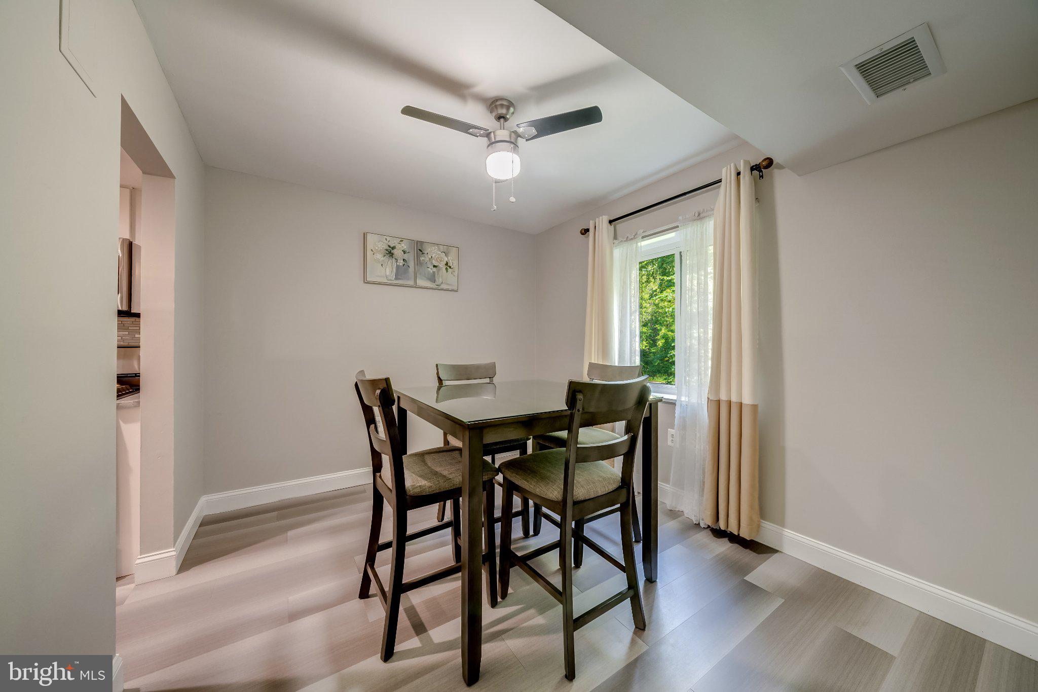 1429 Northgate Square, Unit 2A Reston, VA 20190 - Photo 17 of 25 a view of a dining room with furniture and a window