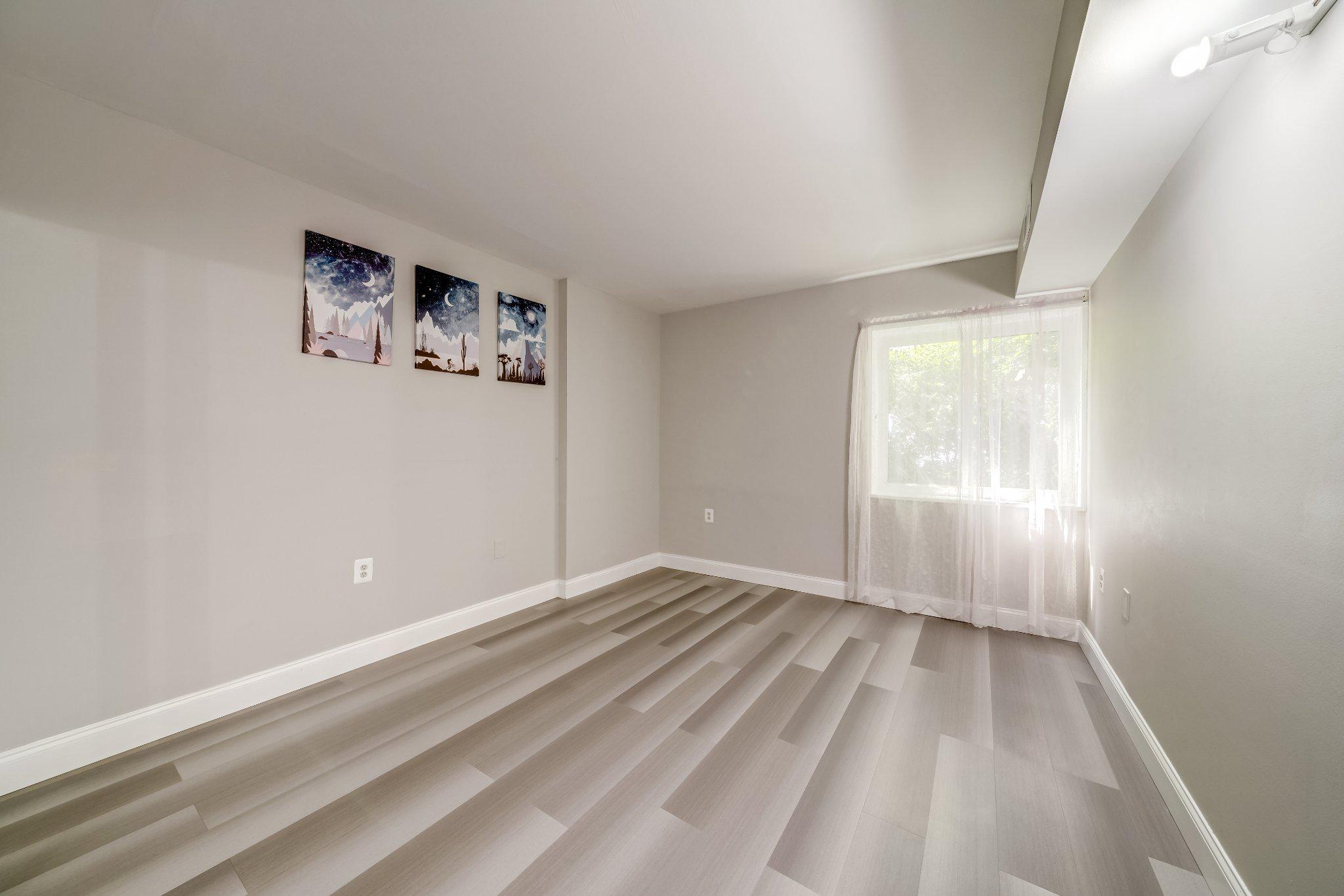 1429 Northgate Square, Unit 2A Reston, VA 20190 - Photo 19 of 25 wooden floor in an empty room with a window