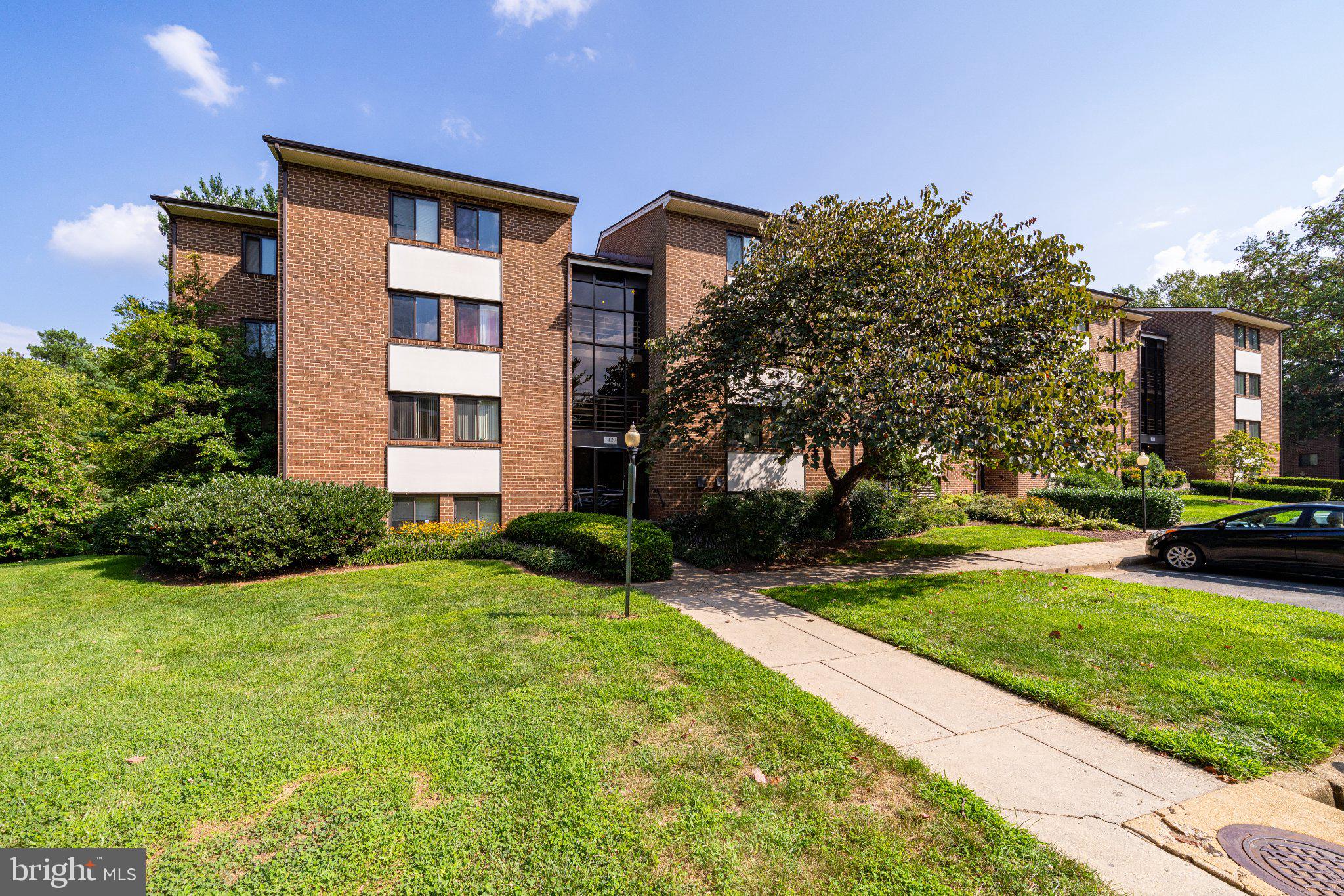 1429 Northgate Square, Unit 2A Reston, VA 20190 - Photo 2 of 25 a front view of house with yard and green space